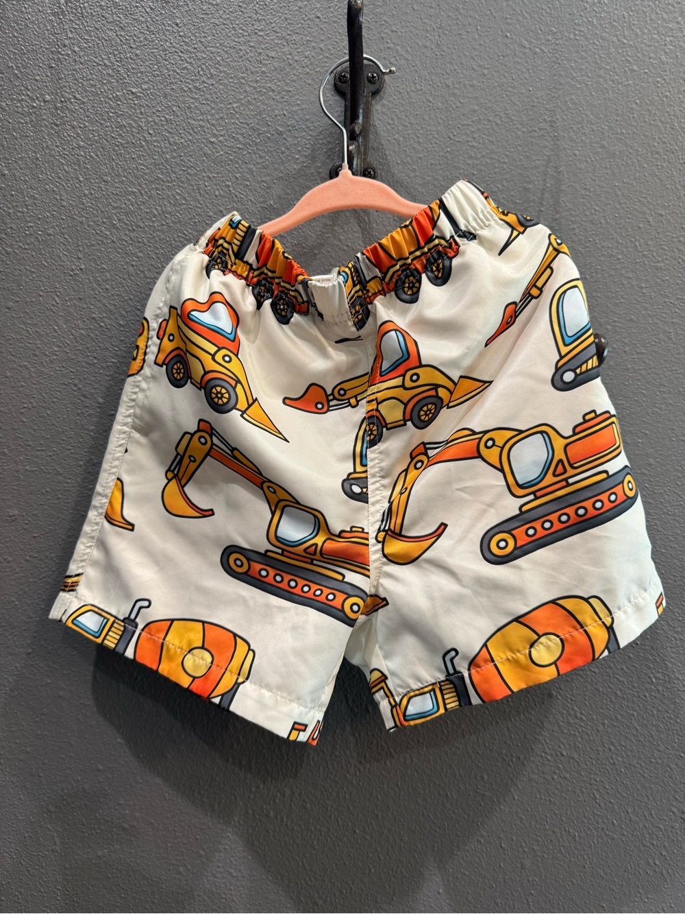 Cream Kids Swim Trunks with Orange Construction Print